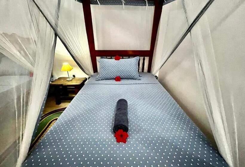 اتاق استاندارد سه تخته با چشم‌انداز باغ, Chikachika Beach B&b