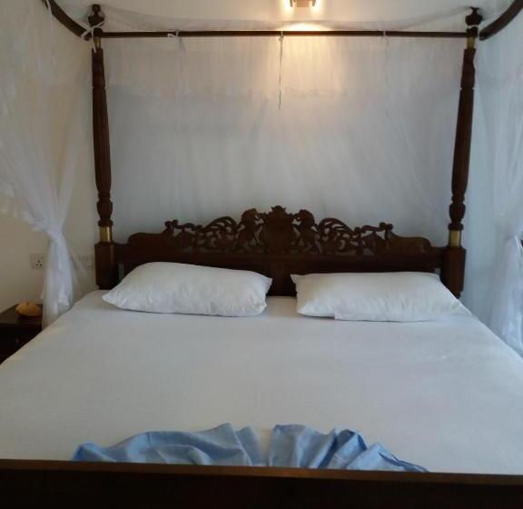 Quarto Deluxe Vista Mar, Peacock Wings Guest