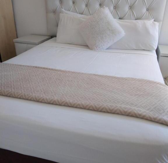 Quarto Estandar Vista Jardim, La Saville Bnb