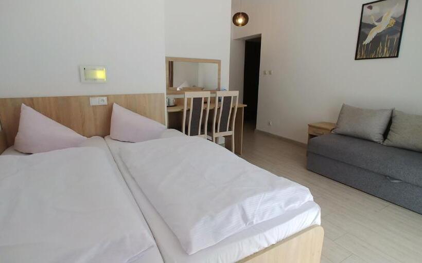 Quarto Quadruple Standart com Varanda, Riwiera Dźwirzyno