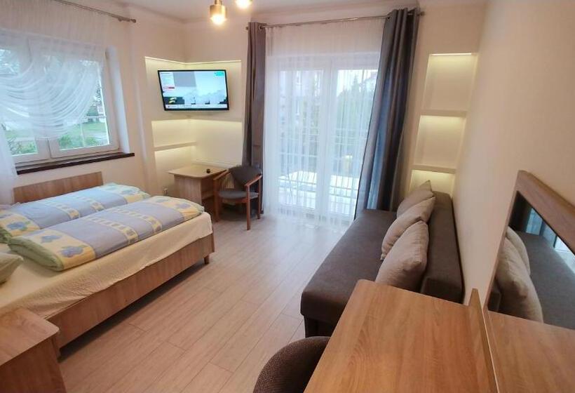 Quarto Quadruple Standart com Varanda, Riwiera Dźwirzyno