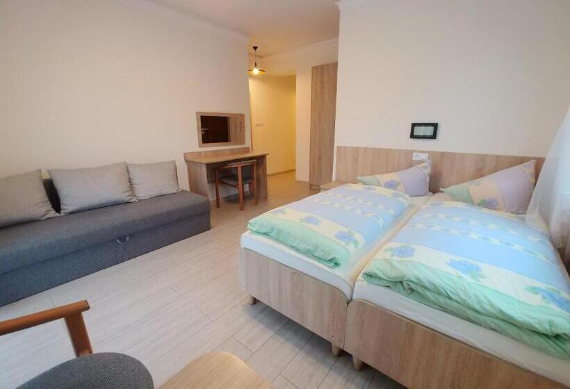Quarto Quadruple Standart com Varanda, Riwiera Dźwirzyno