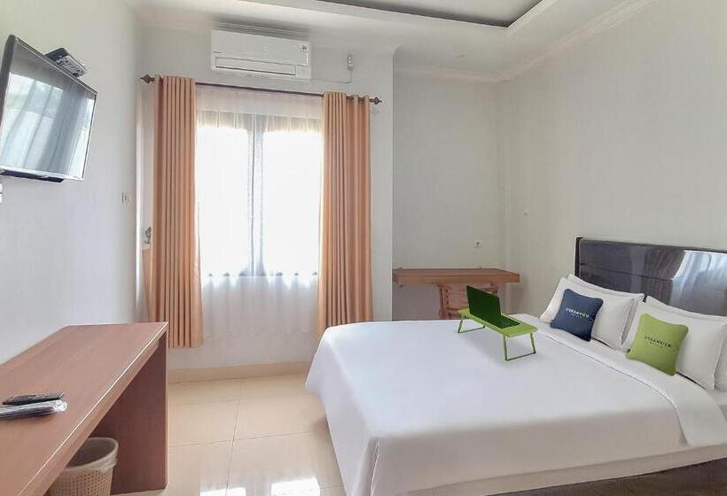 Номер Deluxe, Urbanview Syariah Wisma Annisa Palangkaraya By Reddoorz