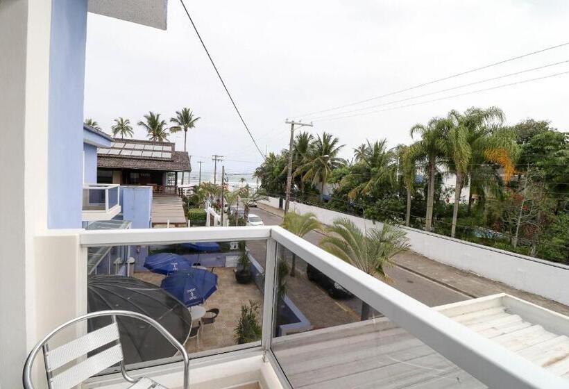 اتاق استاندارد چهارنفره با چشم‌انداز جانبی دریا, Charme Hotel Guarujá Frente Mar