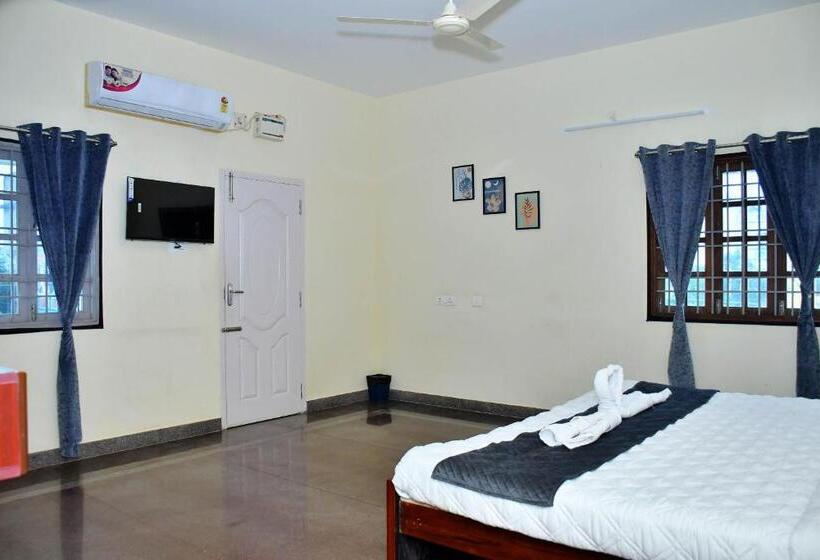 Quarto Deluxe, Revive Inn Pondy   Rooms & Villa