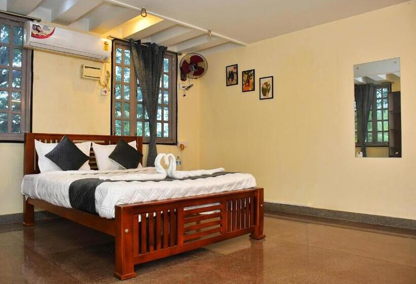 Quarto Deluxe, Revive Inn Pondy   Rooms & Villa