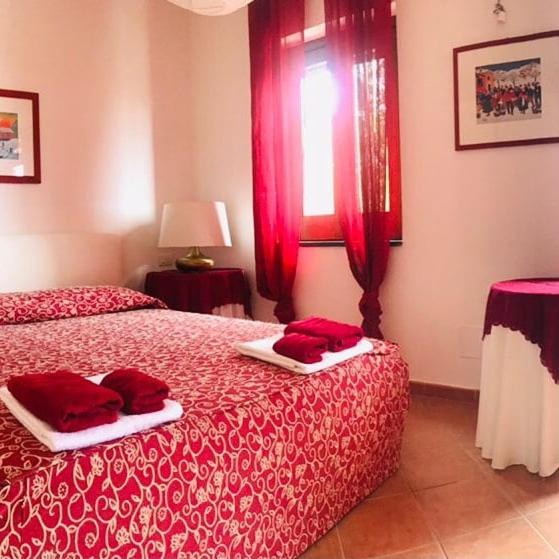 اتاق لوکس با چشم‌انداز دریا, Il Carrubo B&b