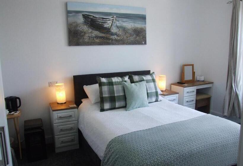 חדר דחוקס עם מיטת קינג, Coach Guest House