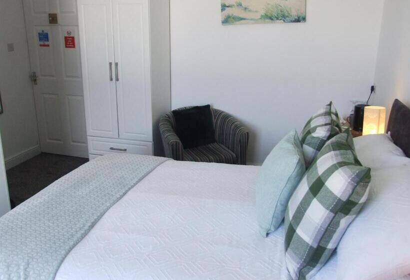 חדר דחוקס עם מיטת קינג, Coach Guest House