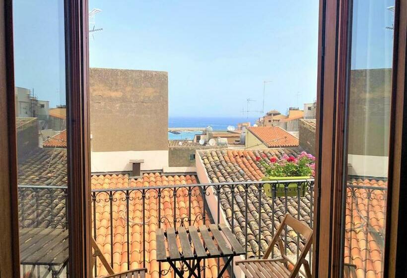 Quarto Quadruple Standart com Varanda, Badia Rooms & Breakfast