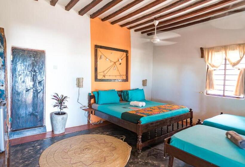 اتاق استاندارد سه تخته با چشم‌انداز باغ, Pili Pili Beach Bungalows
