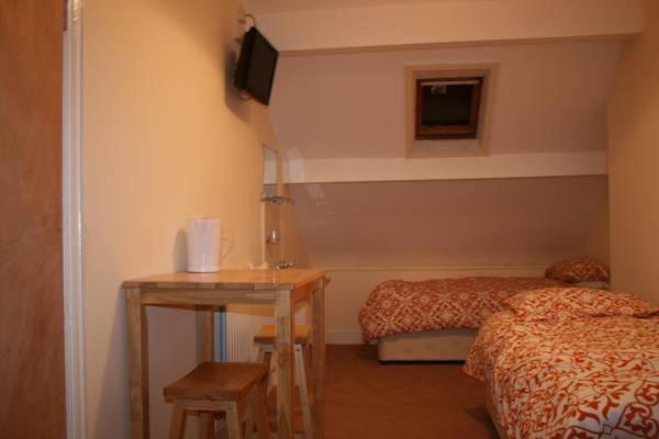 Четырехместный номер эконом класса с общей ванной комнатой, Bayside Guest House