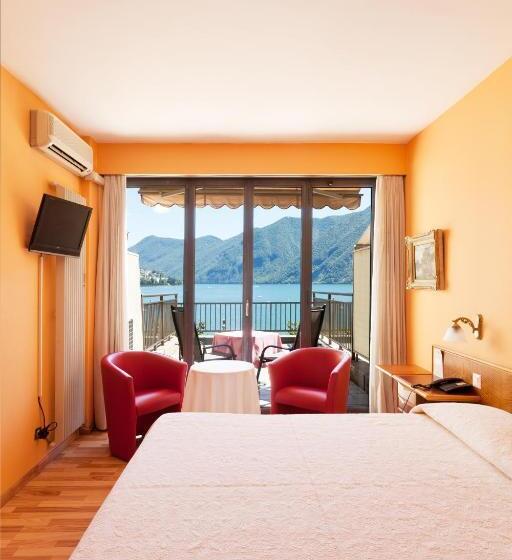 Superior room with lake view, Swiss Lodge Nassa Garni